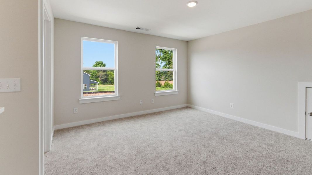 Loft with carpet and windows