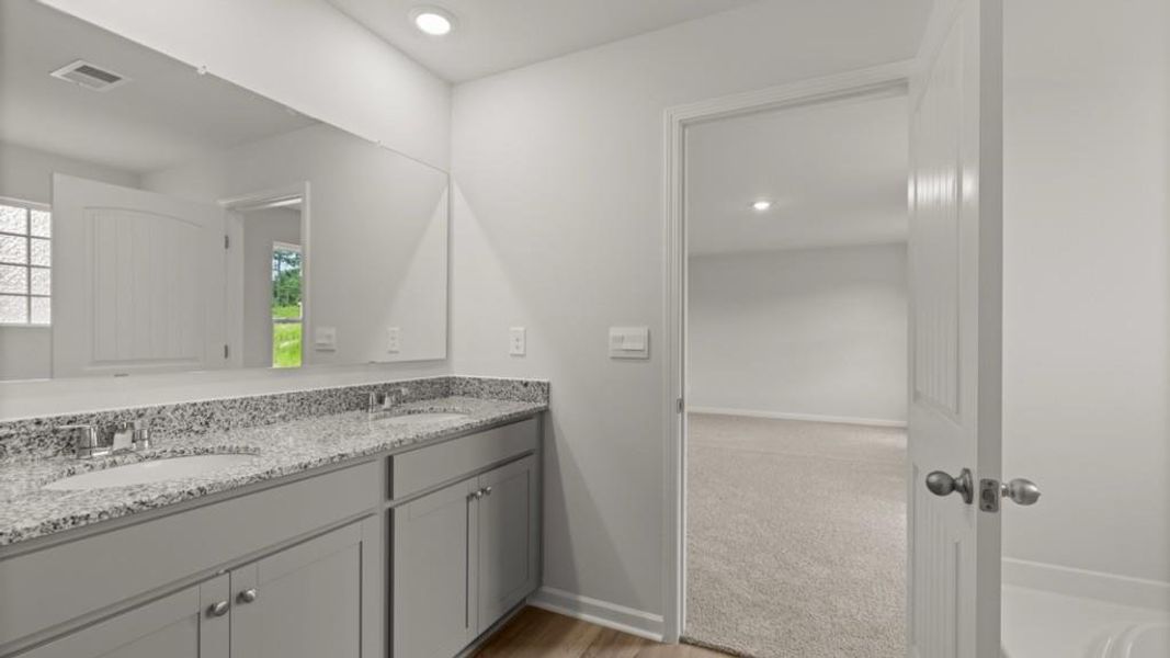 Furnished interior view inside a new home in Northwoods at Mirror Lake, Villa Rica (Image 12).
