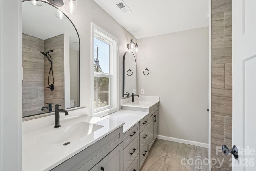 Primary Bathroom with large vanities and lots of natural light