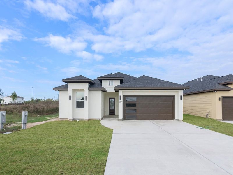 Front exterior of a new home in , Cleveland, TX, highlighting curb appeal (Image 25). Front exterior of a new home in , Cleveland, TX, highlighting curb appeal (Image 25).