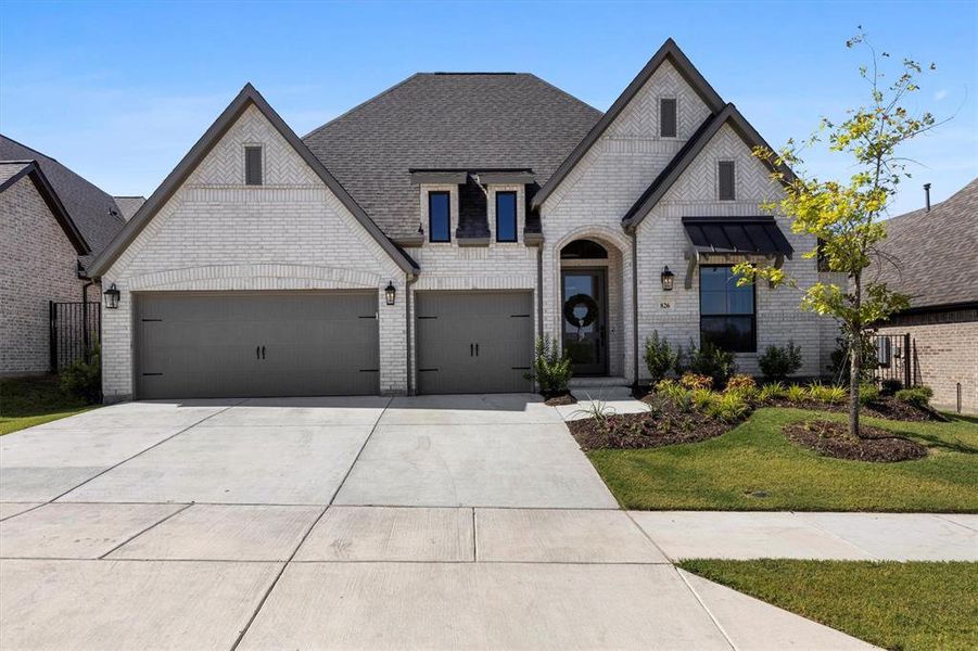 Front exterior of a new home in , Lavon, TX, highlighting curb appeal (Image 22). Front exterior of a new home in , Lavon, TX, highlighting curb appeal (Image 22).