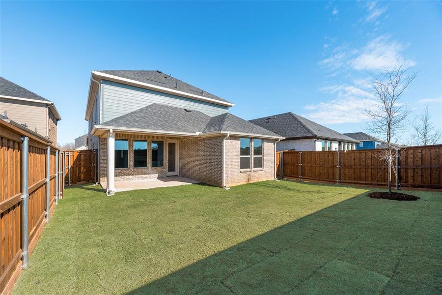 Exterior details and patio area of a home in Spiritas Ranch, Little Elm (Image 18).