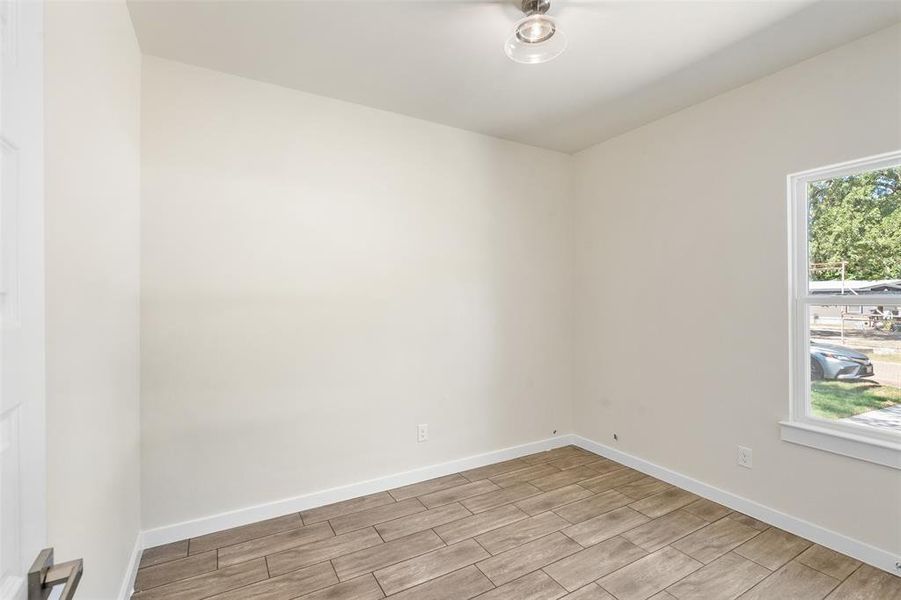 Neutral-toned walls complement wood-finish flooring in this bright room Neutral-toned walls complement wood-finish flooring in this bright room