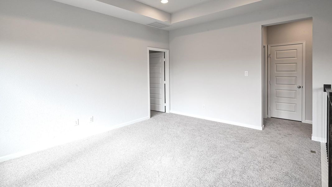 Spare room with light carpet and recessed lighting Spare room with light carpet and recessed lighting
