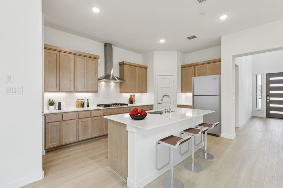 Kitchen in the Da Vinci II home plan by Trophy Signature Homes – REPRESENTATIVE PHOTO