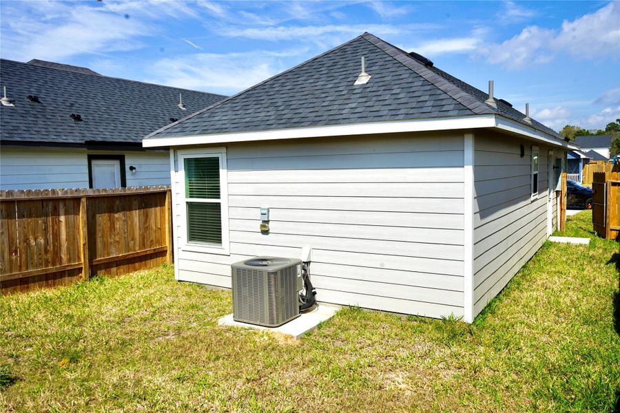 Exterior details and patio area of a home in , Conroe (Image 14).