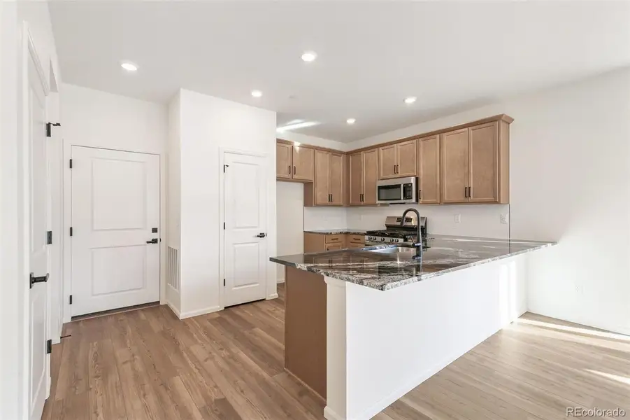 Furnished interior view inside a new home in Turnberry Villas, Commerce City (Image 14).