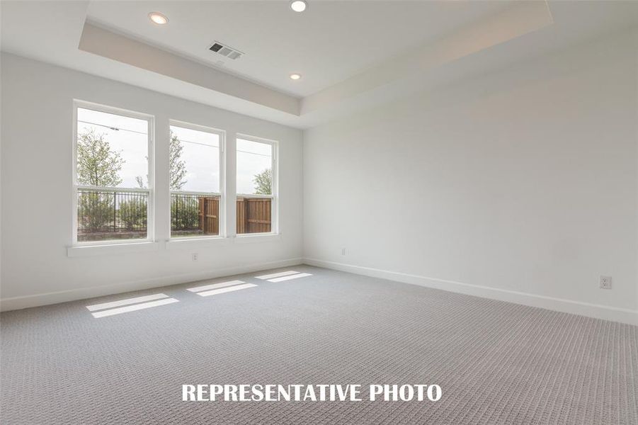 The peaceful owner's suite is located at the back of the home for additional privacy.  REPRESENTATIVE PHOTO