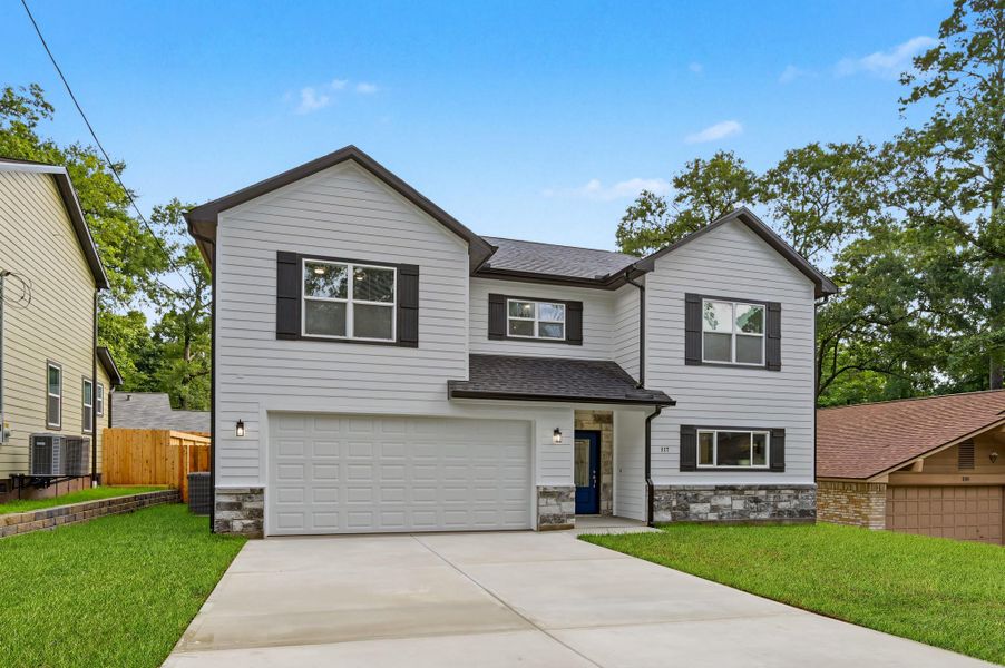 Front exterior of a new home in , Conroe, TX, highlighting curb appeal (Image 2). Front exterior of a new home in , Conroe, TX, highlighting curb appeal (Image 2).
