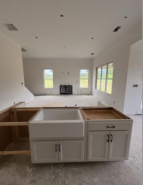 Kitchen island base with white cabinetry and dark hardware Kitchen island base with white cabinetry and dark hardware