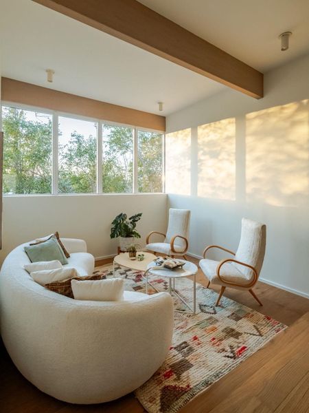 Sunroom with wood finished floors and beamed ceiling