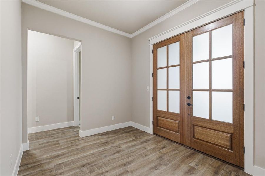 Double French doors featuring frosted glass panels Double French doors featuring frosted glass panels