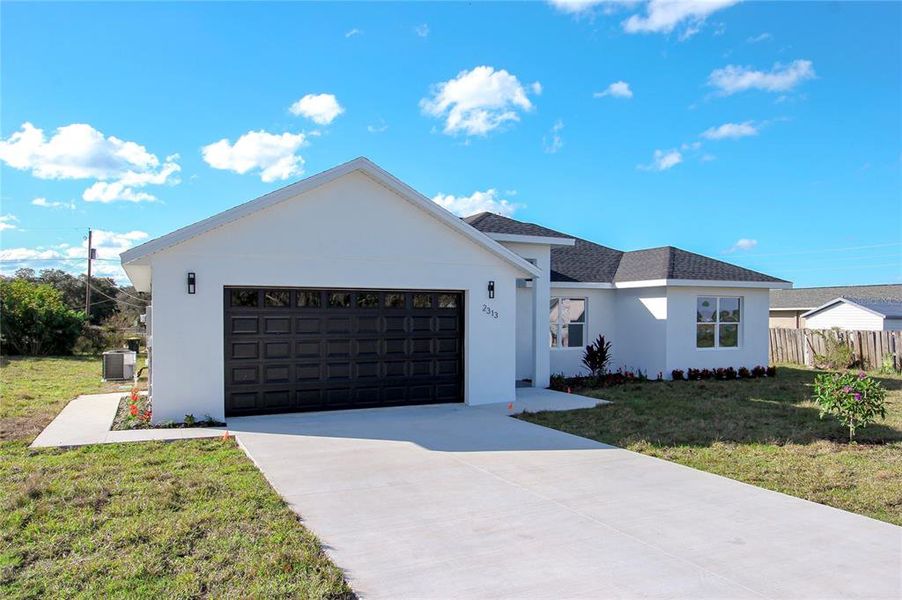 Front exterior of a new home in , Avon Park, FL, highlighting curb appeal (Image 2). Front exterior of a new home in , Avon Park, FL, highlighting curb appeal (Image 2).
