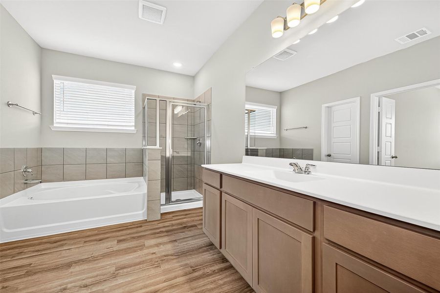 Furnished interior view inside a new home in Sunterra, Katy (Image 19).