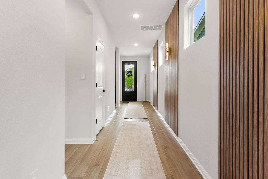 Hallway featuring recessed lighting and light wood-type flooring