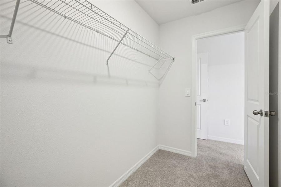 Spacious, unfurnished interior of a new home in The Reserve at Hammock Oaks Townes, Lady Lake (Image 22).