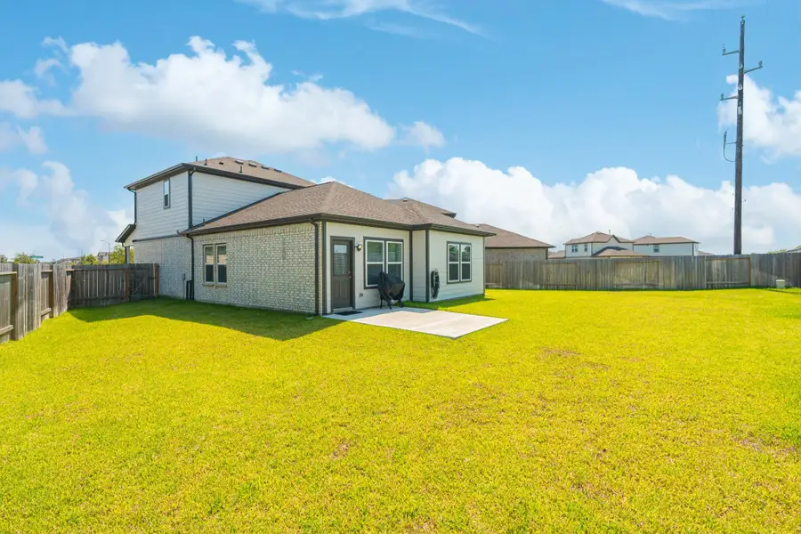 Front exterior of a new home in Lonestar Collection at Aurora, Katy, TX, highlighting curb appeal (Image 2). Front exterior of a new home in Lonestar Collection at Aurora, Katy, TX, highlighting curb appeal (Image 2).