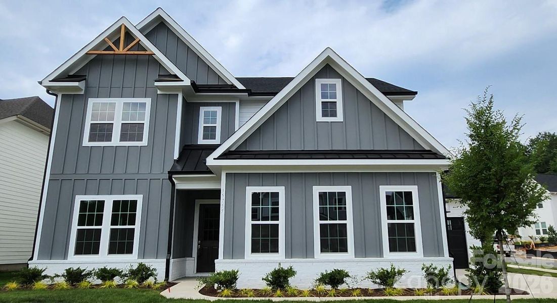 Front exterior of a new home in Coventry Glen, Huntersville, NC, highlighting curb appeal (Image 1). Front exterior of a new home in Coventry Glen, Huntersville, NC, highlighting curb appeal (Image 1).