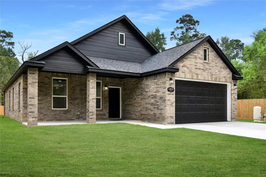 Front exterior of a new home in , Conroe, TX, highlighting curb appeal (Image 1). Front exterior of a new home in , Conroe, TX, highlighting curb appeal (Image 1).