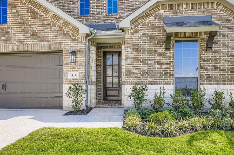 View of exterior entry featuring brick siding View of exterior entry featuring brick siding
