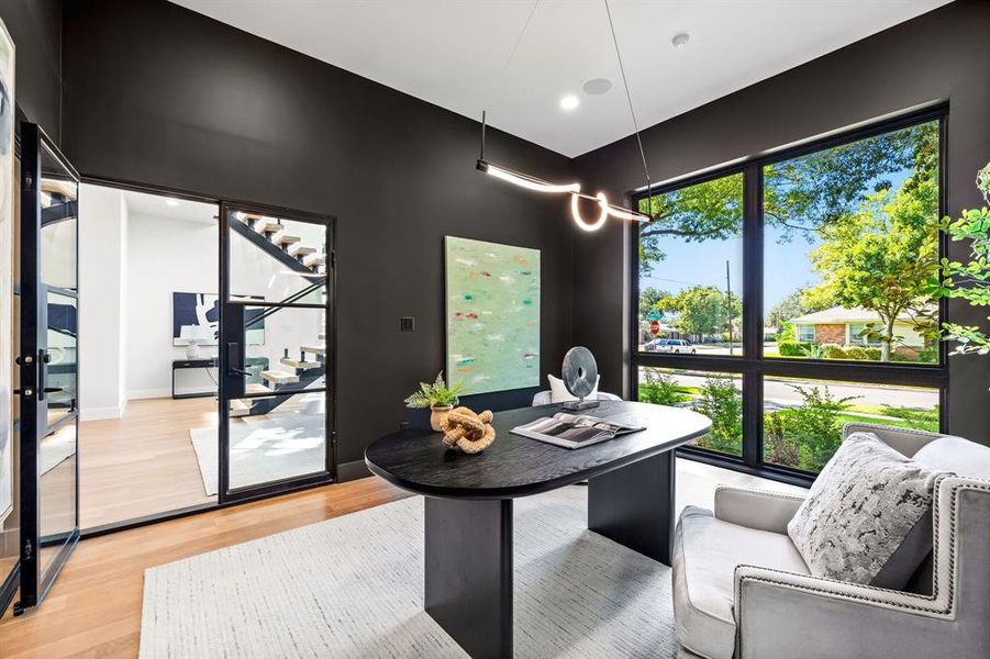 Dining space featuring light wood finished floors and an office area Dining space featuring light wood finished floors and an office area