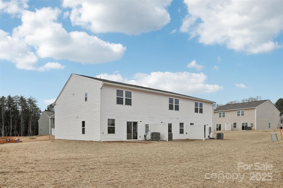 Exterior details and patio area of a home in The Towns at Green Needles, Lexington (Image 9).