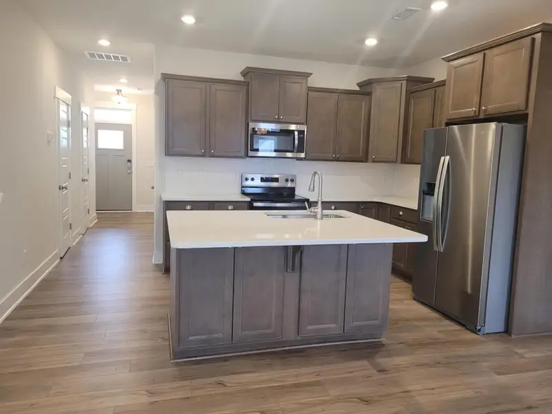 Furnished interior view inside a new home in 1158 Place Townhomes, Wilson (Image 3).