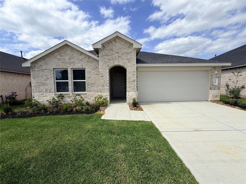 Front exterior of a new home in Cypress Green, Hockley, TX, highlighting curb appeal (Image 1). Front exterior of a new home in Cypress Green, Hockley, TX, highlighting curb appeal (Image 1).