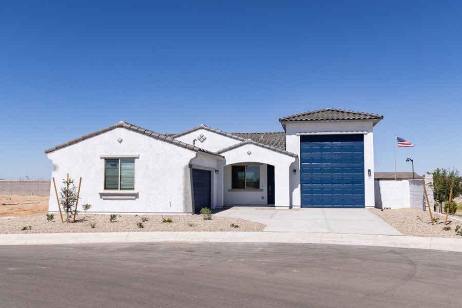 Front exterior of a new home in Rancho Mirage, Maricopa, AZ, highlighting curb appeal (Image 1). Front exterior of a new home in Rancho Mirage, Maricopa, AZ, highlighting curb appeal (Image 1).