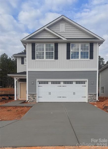 Front exterior of a new home in Village at Parkside, Gastonia, NC, highlighting curb appeal (Image 1). Front exterior of a new home in Village at Parkside, Gastonia, NC, highlighting curb appeal (Image 1).