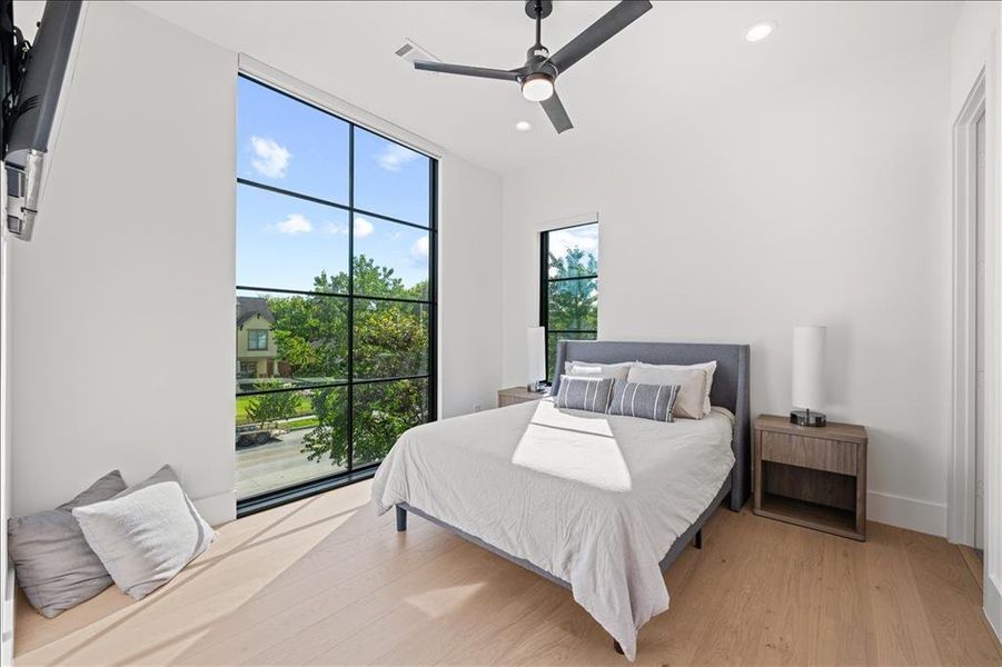 3rd bedroom with wood finished floors, ceiling fan, recessed lighting, and access to exterior