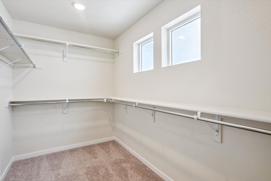 A room with a metal railing and a window.