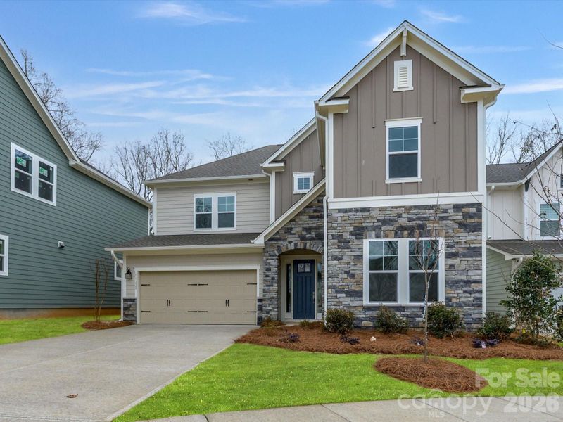 Front exterior of a new home in North Creek Village, Huntersville, NC, highlighting curb appeal (Image 23).