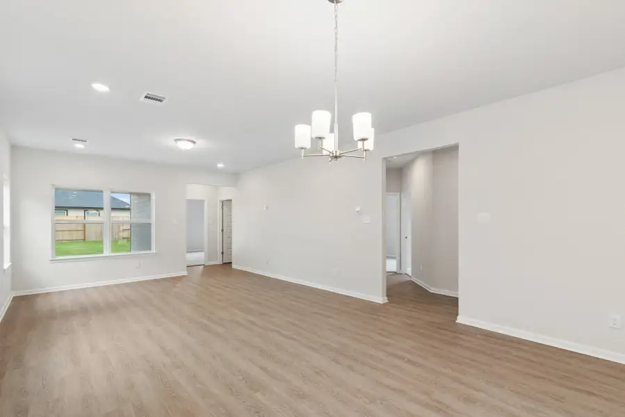 The Oakshire II- Family Room into Secondary Bedrooms Hallway.  Sample image for illustration; upgrades, options, and colors may vary.