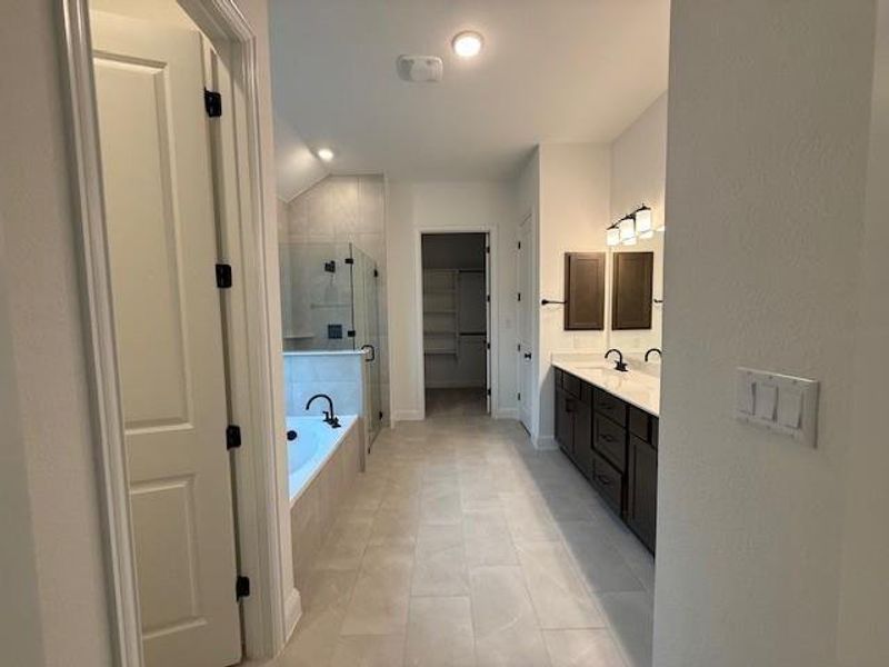 Primary Bath retreat with dual vanities, garden tub & walk-in shower