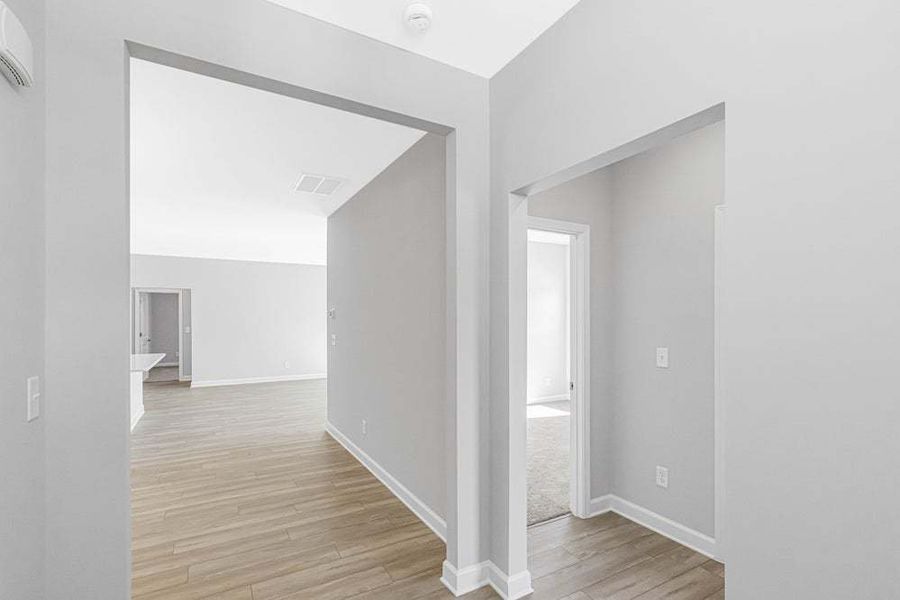 Representative unfurnished interior of a home built from the Weymouth by Caviness & Cates Communities in Bartlett Manor, Youngsville (Image 37).