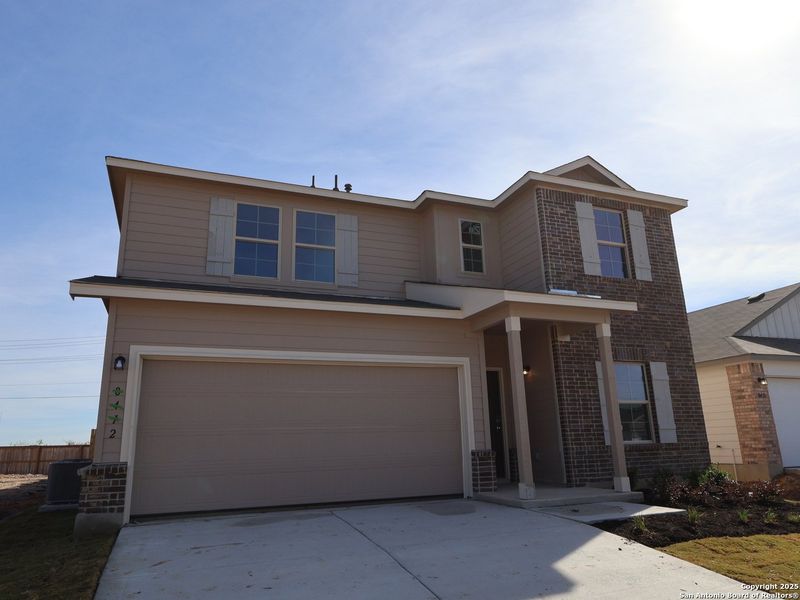 Front exterior of a new home in Agave, San Antonio, TX, highlighting curb appeal (Image 26).