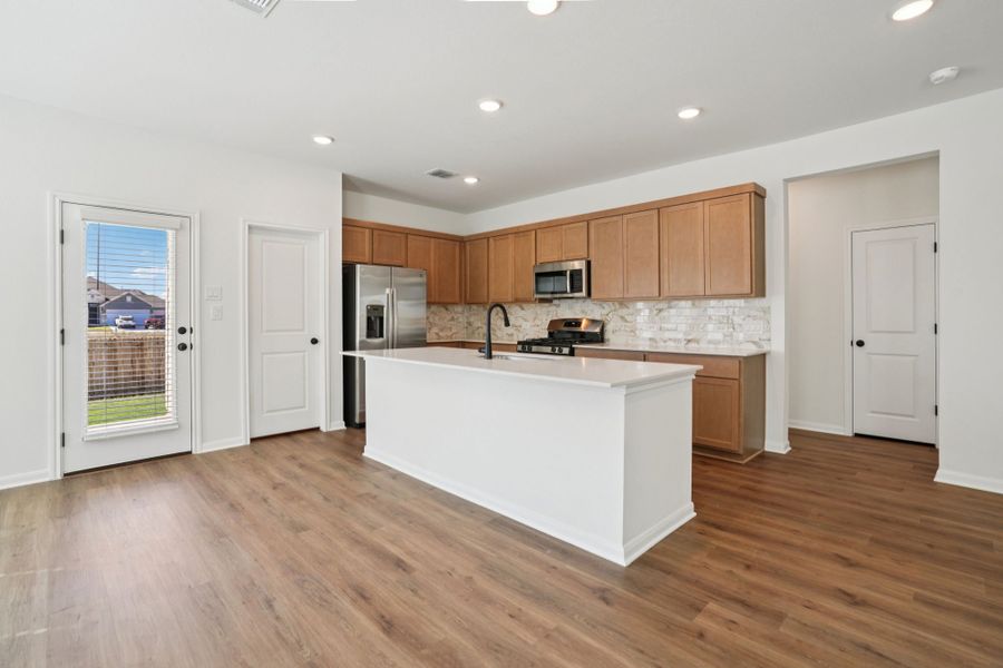 Furnished interior view inside a new home in Village at Three Oaks, Seguin (Image 5).