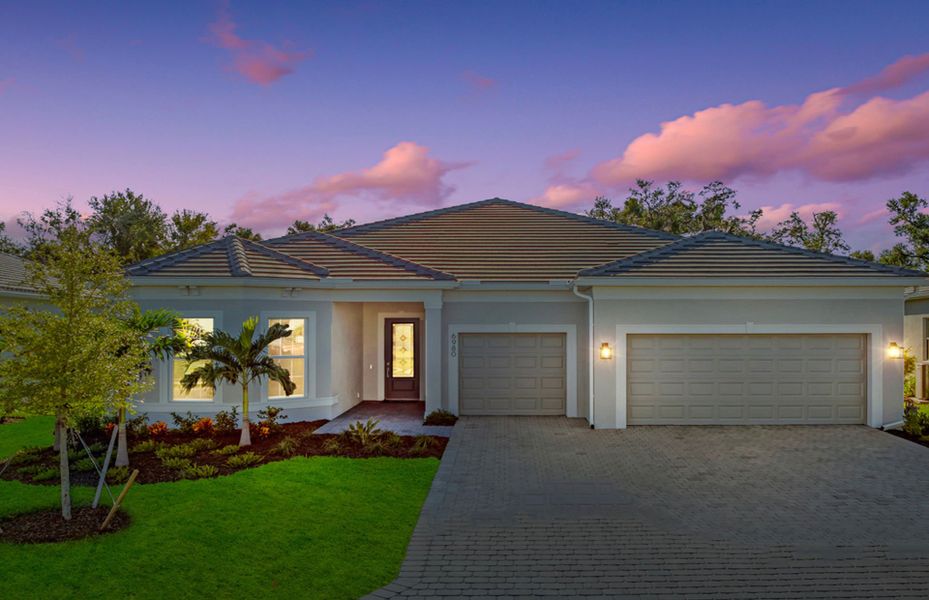Front exterior of a new home in Del Webb Oak Creek, North Fort Myers, FL, highlighting curb appeal (Image 23). Front exterior of a new home in Del Webb Oak Creek, North Fort Myers, FL, highlighting curb appeal (Image 23).