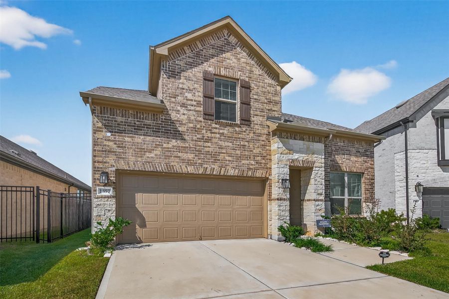 Exterior details and patio area of a home in Sunterra, Katy (Image 3).