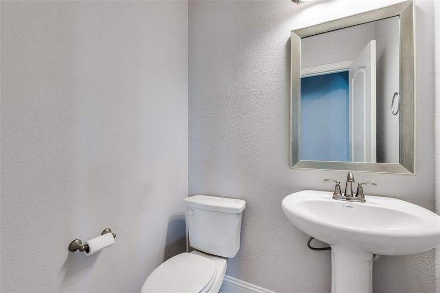 Bathroom with sink and toilet