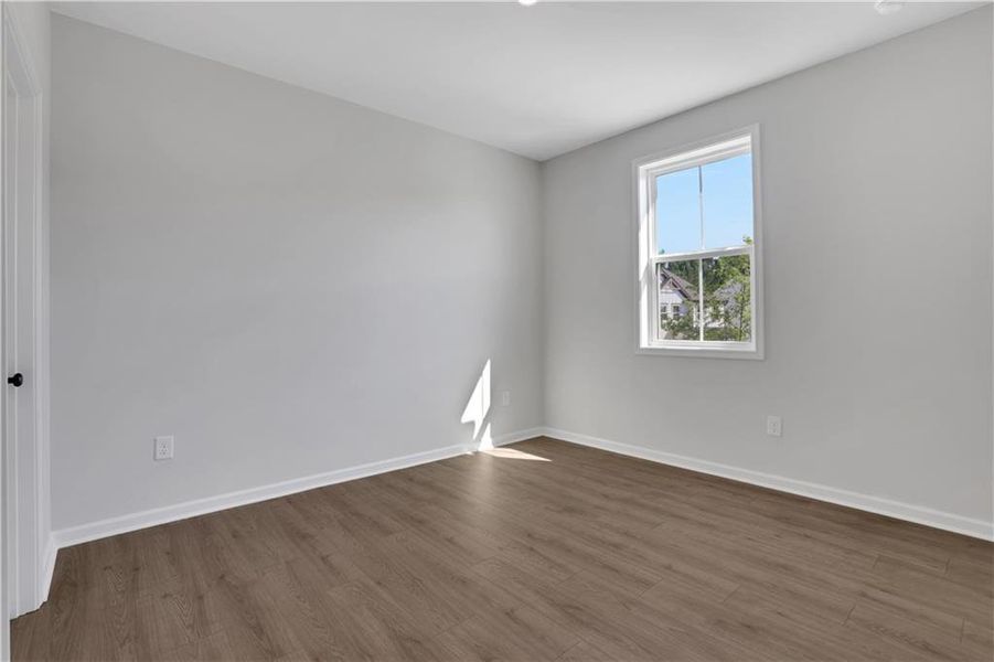 Spacious, unfurnished interior of a new home in The Paddocks at Doc Hughes, Buford (Image 32).