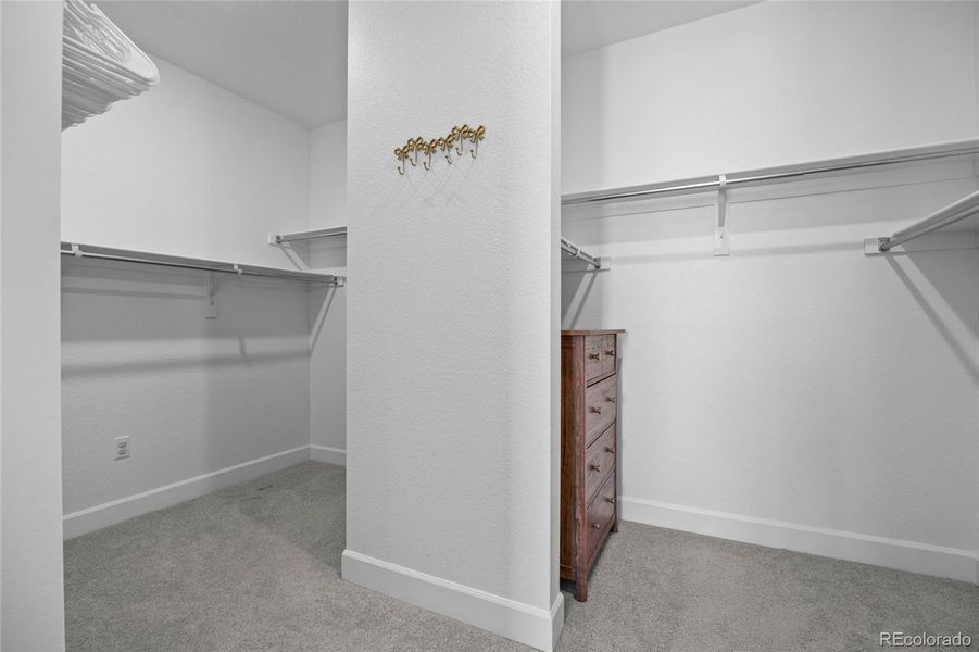 Spacious primary walk-in closet