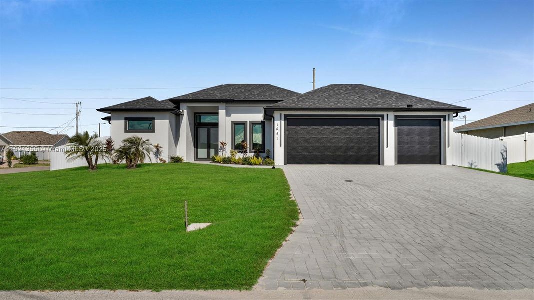 Front exterior of a new home in , Cape Coral, FL, highlighting curb appeal (Image 1).
