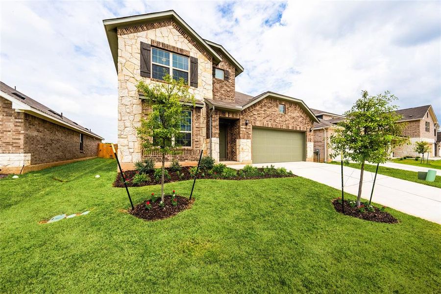 Front yard, Live Oaks, Flower bed, two car garage