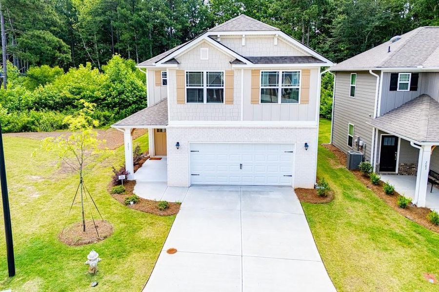 Front exterior of a new home in Windmill Park, Carrollton, GA, highlighting curb appeal (Image 30). Front exterior of a new home in Windmill Park, Carrollton, GA, highlighting curb appeal (Image 30).