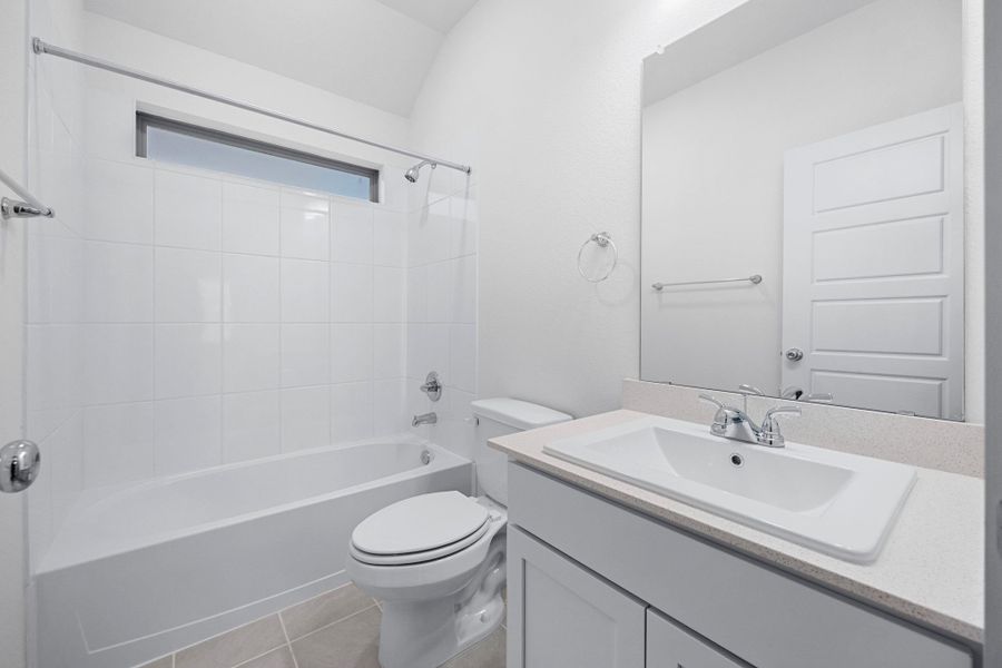 Bathroom in the Cypress home plan by Trophy Signature Homes - REPRESENTATIVE PHOTO