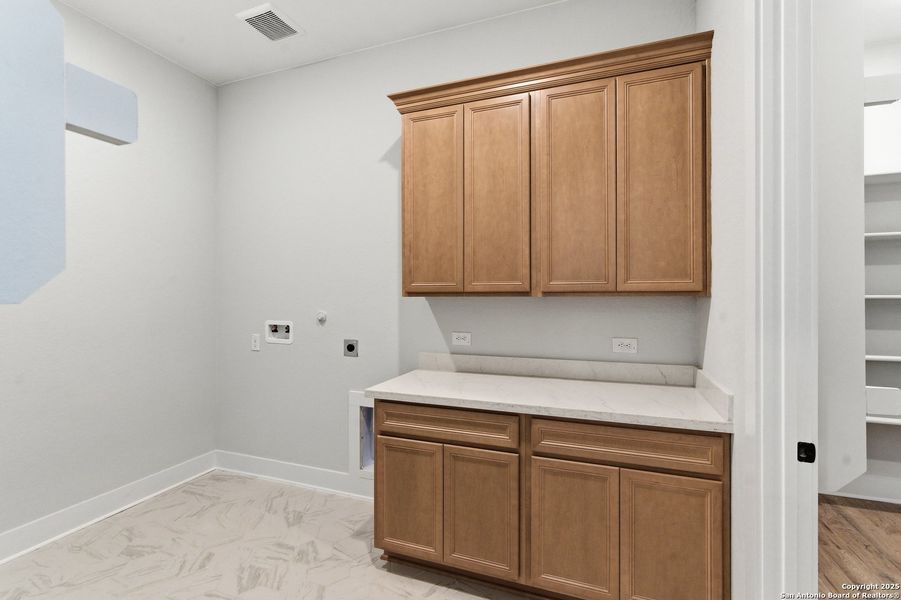 Furnished interior view inside a new home in Potranco Oaks, Castroville (Image 11).