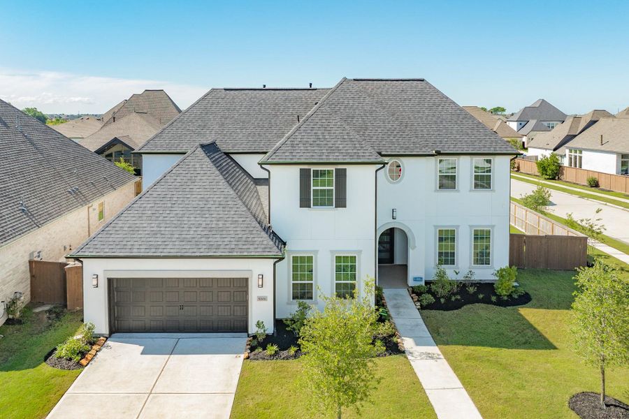 Aerial view of the home’s exterior showcasing the spacious corner lot position and convenient cul-de-sac location.