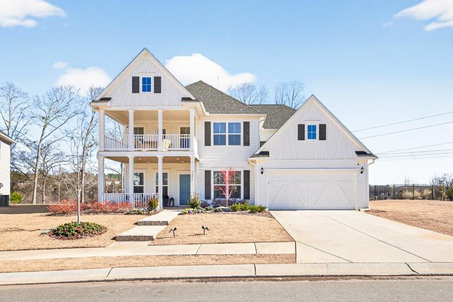 Front exterior of a new home in Reunion, Flowery Branch, GA, highlighting curb appeal (Image 2).